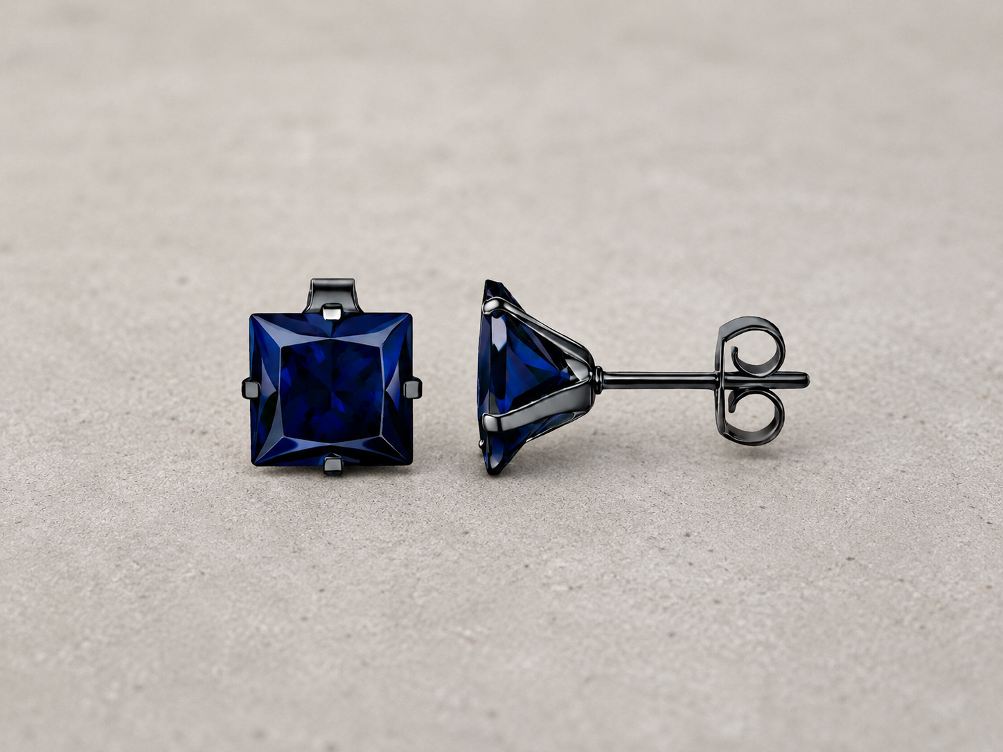 Close-up van edelstalen heren studs in zwart en zilverkleurig