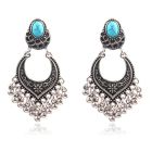 Dames oorhangers zilverkleurig turquoise met zilverkleurige kraaltjes