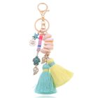 Handgemaakte Ibiza sleutelhanger goudkleurig blauw geel met schelpjes