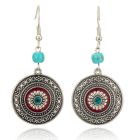 Ronde zilverkleurige dames oorhangers rode en turquoise details