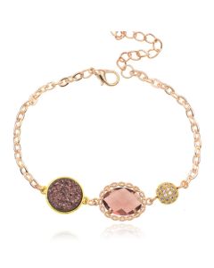 Goudkleurige verstelbare dames armband met roze glassteen